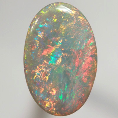 SOLID SEMI BLACK OPAL Top quality. Floral Harlequin pattern, very bright and sparkling red and orange. SEE VIDEO  
